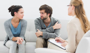 Young couple in meeting with a financial adviser at home